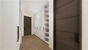 Walk in closet featuring light tile floors