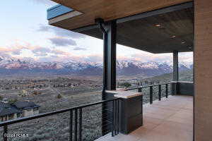 Balcony at dusk with a mountain view