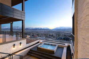 Balcony featuring an outdoor hot tub