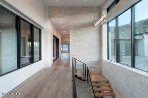 Hallway with wood-type flooring