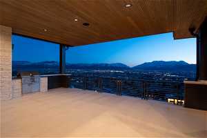 View of patio / terrace with a mountain view, a balcony, area for grilling, and an outdoor kitchen