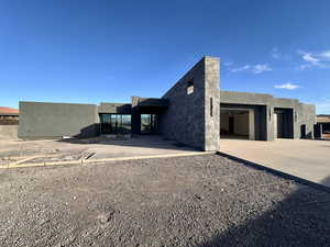 Back of house featuring a garage