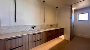 Bathroom featuring vanity and tile patterned floors