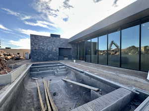 View of swimming pool with exterior kitchen