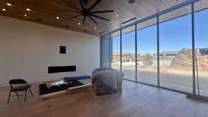 Interior space featuring ceiling fan and wood ceiling