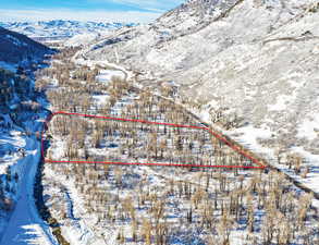 Snowy aerial view with a mountain view