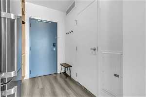 Doorway to outside featuring light hardwood / wood-style floors