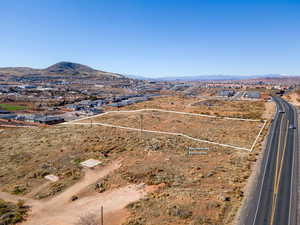 Birds eye view of property with a mountain view