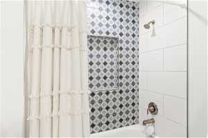 Full Bathroom featuring shower / bath combo with shower curtain