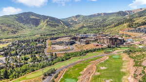 Drone / aerial view of mountains and a local golf course