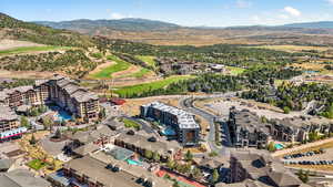 Aerial overview of property's location with a mountain backdrop