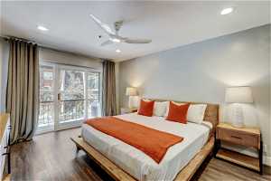 Bedroom featuring hardwood / wood-style floors, ceiling fan, and access to outside