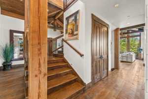 Staircase with hardwood / wood-style floors