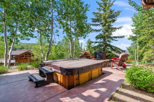 View of terrace featuring a hot tub