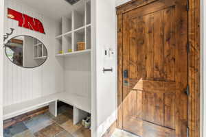 Mudroom with tile floors