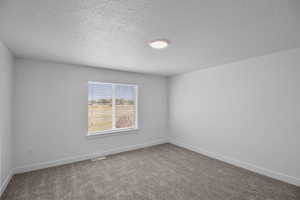 Primary Bedroom with a large window