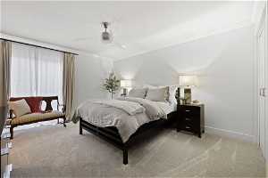 Bedroom featuring ceiling fan, ornamental molding, and light carpet