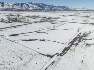 Snowy aerial view with a mountain view