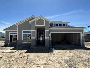 View of front of property featuring a garage