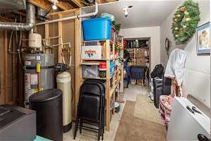 Storage area featuring water heater
