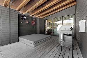 Wooden deck with a covered hot tub