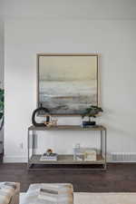 Detailed view of baseboards and wood finished floors