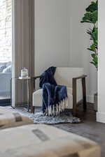 Living area featuring baseboards and wood finished floors