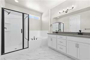 Bathroom featuring tile floors, large vanity, separate shower and tub, and dual sinks