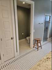 Primary Bathroom featuring tile floors