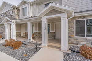 Property entrance with covered porch