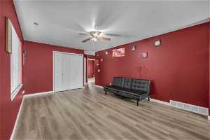 Unfurnished room with ceiling fan and light hardwood / wood-style flooring