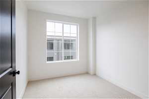3rd floor bedroom. Photo is from a similar unit in the development. Some fixtures may differ