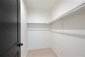 3rd floor primary walk in closet. Photo is from a similar unit in the development. Some fixtures may differ