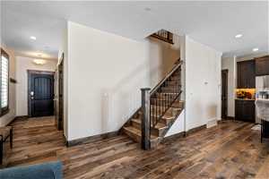 Foyer featuring dark hardwood / wood-style flooring and a textured ceiling