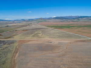 Birds eye view of property with a mountain view and a rural view