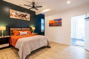 Master Bedroom with access to outside, light wood-type flooring, beam ceiling, and ceiling fan