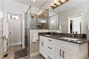 Double vanity master bath with large tub and shower.