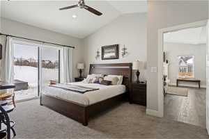 Large master bedroom featuring sliding glass door access to hot tub and yard.