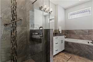 Double vanity master bath with large tub and shower.