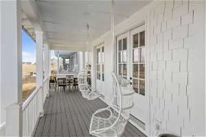 Front deck with dining area and front porch swings