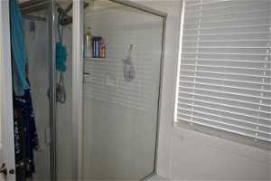 Interior space with a shower with door