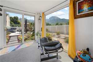 Sunroom featuring a mountain view