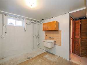 Laundry room with a utility sink.