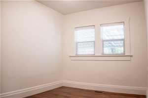 Unfurnished room with wood-type flooring