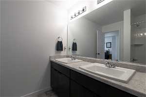 Bathroom featuring double sink and large vanity