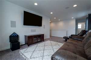 Living room/Loft featuring light carpet with 7 speaker surround sound system.