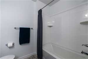 Secondary Bathroom with shower / bath combination  and toilet