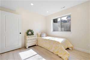 1 of 2 basement apatment / flex area - Bedroom featuring light hardwood / wood-style floors