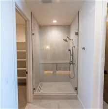 Bathroom with walk in shower and tile floors