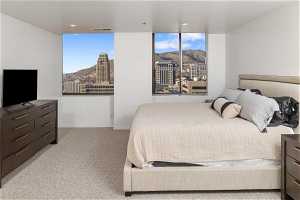 Carpeted bedroom with a mountain view